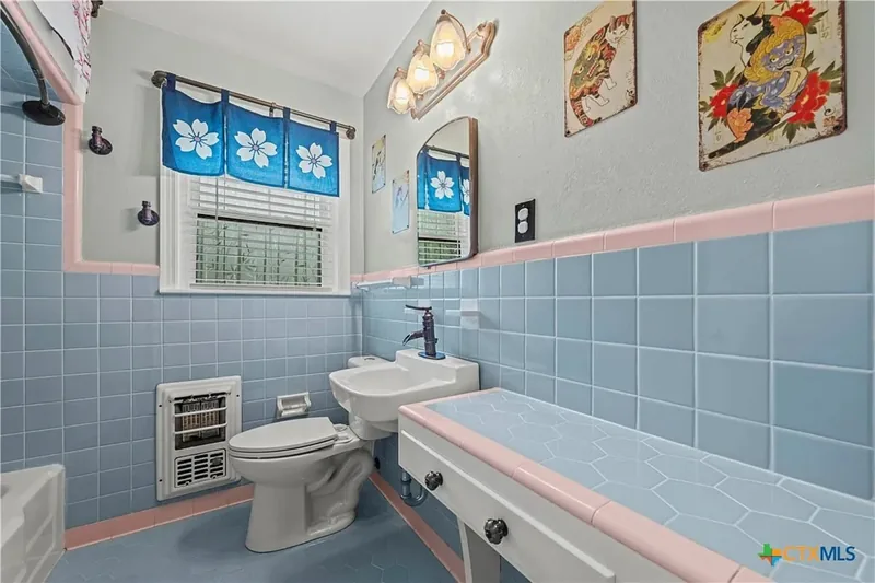 Vintage bathroom with blue and pink tile